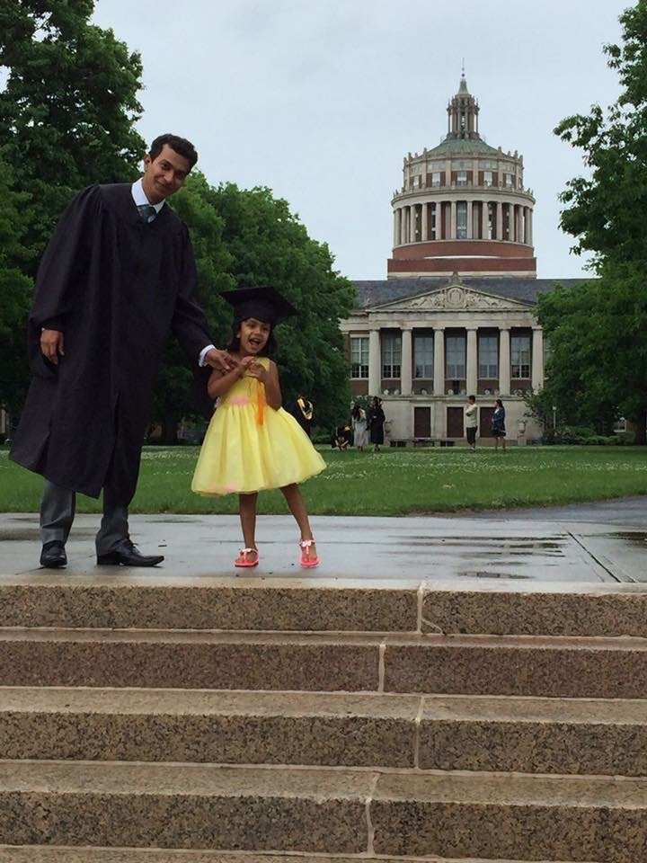 Aanya with her dad at his graduation